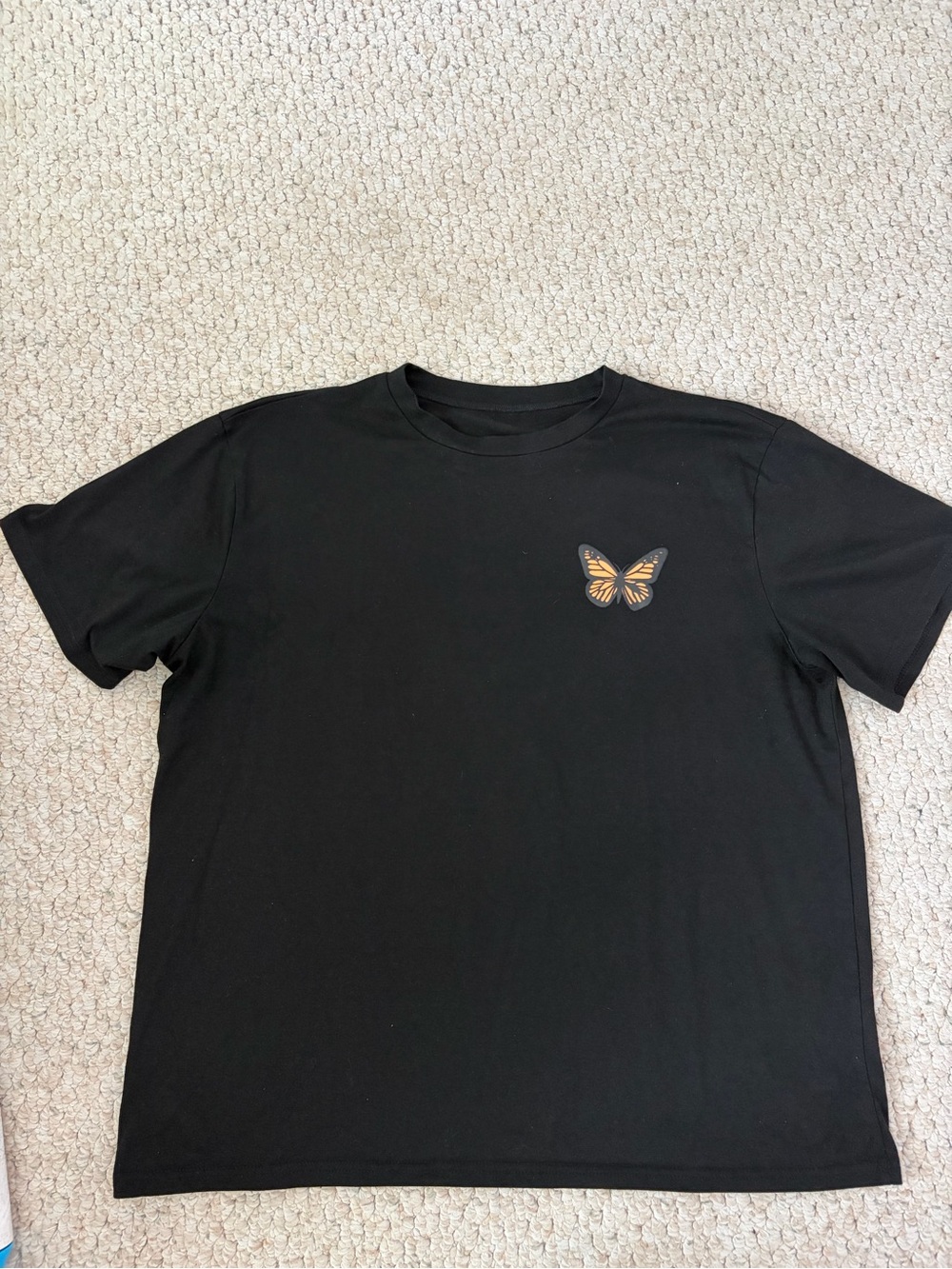 Black T-Shirt with Small Orange Butterfly Graphic
